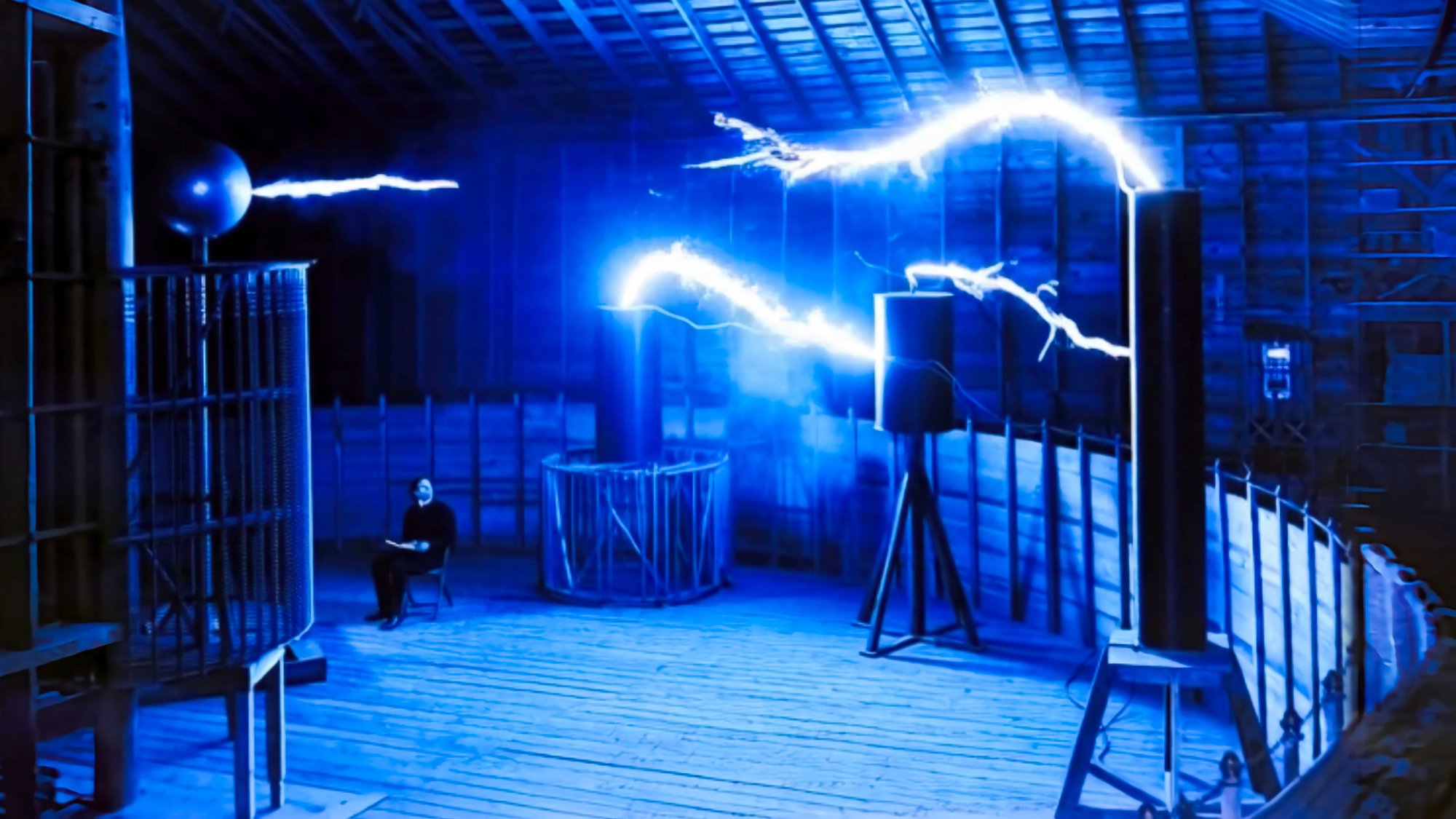 Nikola Tesla in his Colorado Springs laboratory with massive electrical discharge, 1899